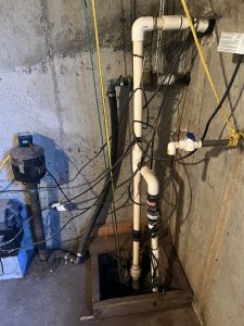 An image of a bad DIY sump pump in a house