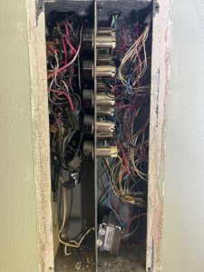 The switches for an electrical relay system in a 1950s MCM home